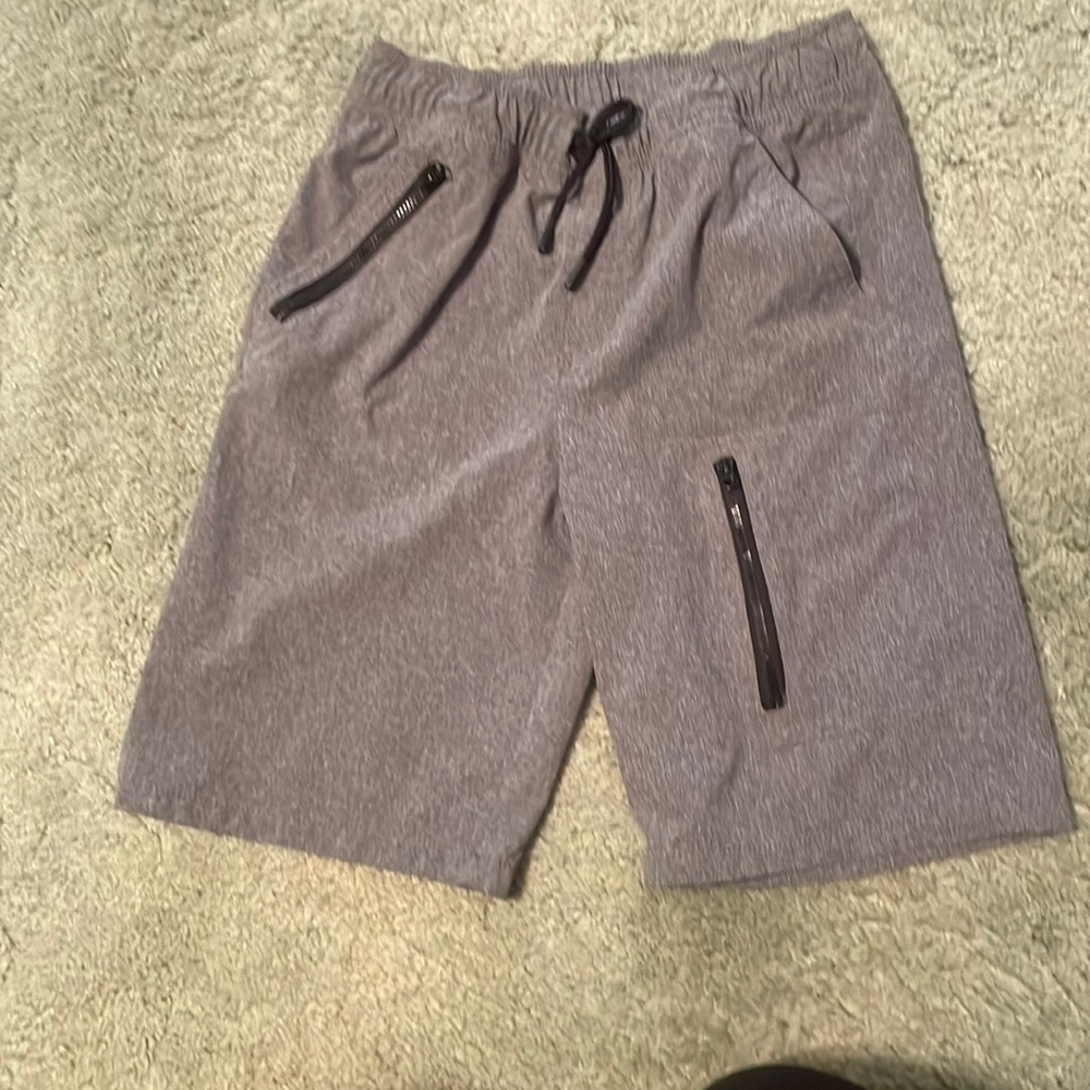 Cat and jack. Size 12/14. Boys shorts but son wore ad a swimsuit.